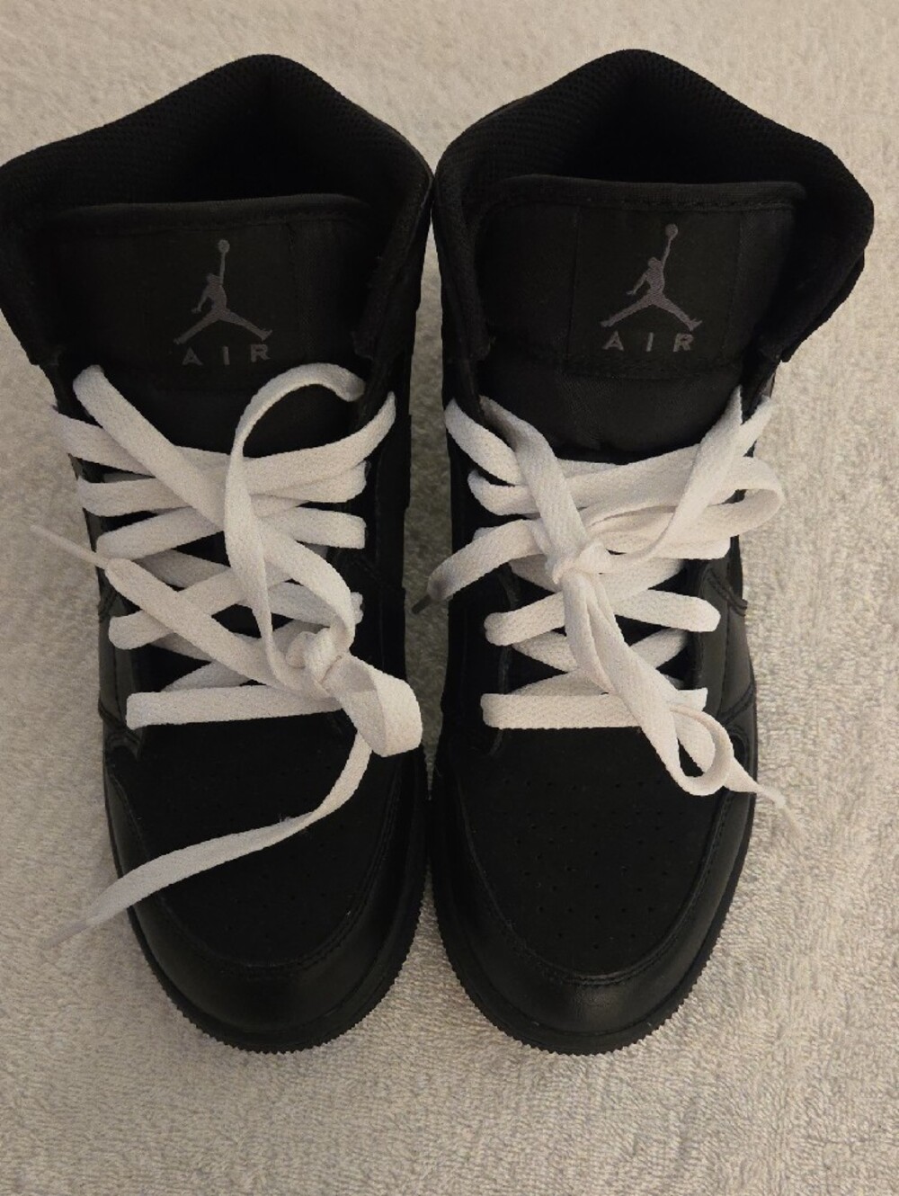 Jordan Kids Black and White High-Top Sneakers